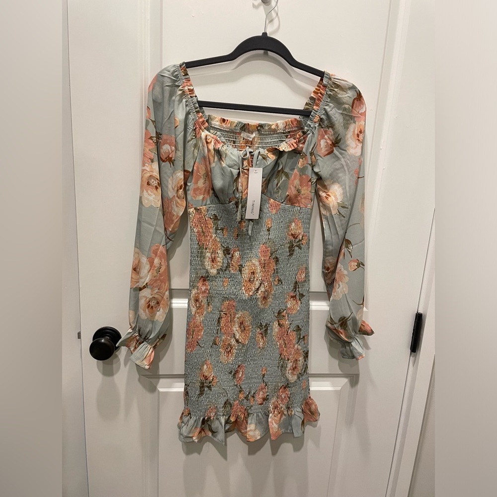 Brand new smocked Timing dress in blue floral. Never worn, with tags.